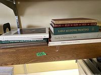 Photo of 4 art books stacked including The Black Presence in the Era of the American Revolution 1770-1800, Interviews with Francis Bacon, Rembrandt, Picasso