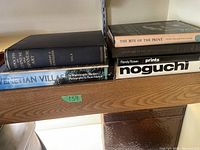 Shelf view showing two books at left and four books at right.