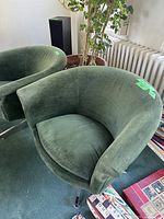 Front view of pair showing curved backs and velvet upholstery