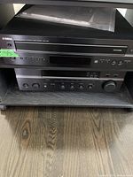 Front view of Yamaha CDC-565 CD changer stacked on RX-397 receiver