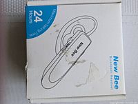 Box of New Bee Bluetooth headset showing 24 hours of maximum talking time and ear hook design illustration.