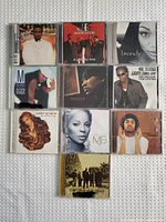 Top view of 10 CDs front covers showing various artists including Brandy, Jagged Edge, Usher, Mr. Cheeks