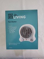 Front of sealed fan heater box showing brand, product image, size and power settings