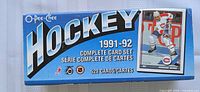 Box front showing the 1991-92 O-Pee-Chee NHL Hockey card complete set with 528 cards, featuring player image and series branding.