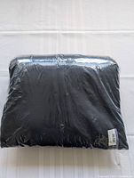 One pair of men's dark navy blue joggers in original sealed plastic packaging with visible label.