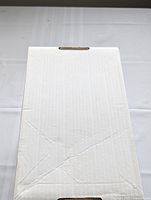 Closed white comic book storage box containing the comics