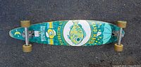 Top views of the Aqua California longboard skateboard showing deck graphics and overall condition.