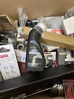 Box view showing Greg Howe Coating Glass bottle, wrenches, and various boxed parts