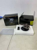 Photo showing airplane diffuser with packaging open and foam insert with oil container.