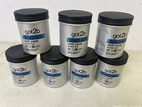 Seven jars of got2b Beach Boy matt paste arranged on white surface, showing full lot and labels clearly.