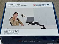 Box of Fleximounts laptop desk mount for laptops 10.1 to 17.3 inches, model L01, showing product branding and size compatibility.
