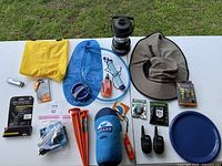 Items displayed on table showing complete camping gear assortment