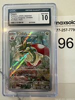 First photograph of a CGC graded Flapple Pokémon card, showing front holographic art and grading information.