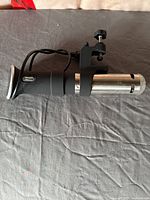 Full view of Anova sous vide cooker with clamp and cord