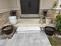 Overall view showing six of the planters on porch and walkway