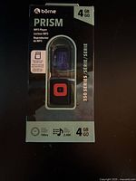 Front of sealed Börne Prism MP3 player box showing 4GB capacity and product image