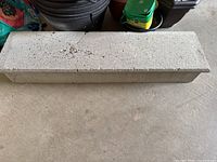Top view of entire concrete step showing full length and surface condition