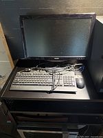 Front view Philips monitor, keyboard, mouse on desk