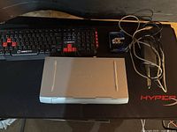 Printer, keyboard, cables, mouse pad overview