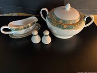 Full set showing soup tureen, gravy boat with underplate, salt and pepper shakers