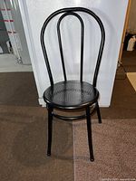 front view of black metal chair