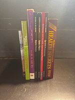 Books standing showing spines for titles and types