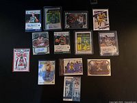 Full view of 14 NBA trading cards arranged on table