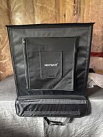 Front view of assembled Neewer lightbox showing zippered front panel and brand name