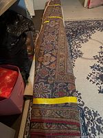Entire rug rolled and taped