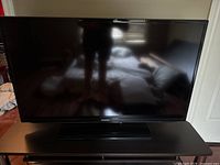 Front view of Samsung flat screen TV on stand