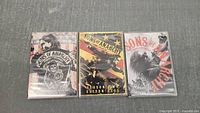 Three DVD box sets for Sons of Anarchy Seasons 1, 2, and 3 displayed side by side showing front cover art and branding.