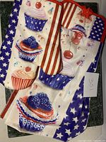 Photo of hanging towel and mitten potholder showing cupcake and American flag-inspired designs