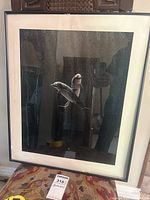 Full view of the framed artwork showing two dolphins.