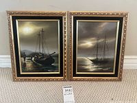 Pair of framed tall ship paintings side by side on beige carpet near a wall.