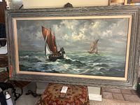 Front view of framed seascape painting showing two sailboats and frame