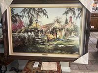 Full view of framed print with carved wood frame and Certificate of Authenticity below