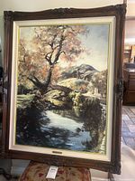 Full view of framed print showing ornate wood frame and artwork