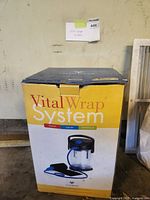 Image showing the VitalWrap System box with a full front view of the packaging, highlighting the product name and listing its capabilities: heating, cooling, and compression.