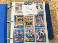 Binder open showing nine 1991 Donruss cards and note with counts