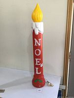 Full view of the 37-inch red NOEL blow mold candle