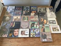 Full overhead view of all 29 CDs on table