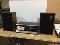 Full view of stereo main unit flanked by two Zenith Allegro speakers