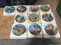 All ten plates front view on boxes