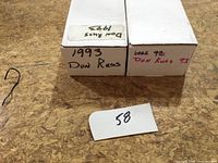 Two closed white storage boxes labelled 1993 Don Russ