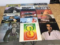 All 20 records laid out in five rows on table