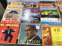 Overview of 12 LP covers including Al Jolson, Robeson, Billy Vaughn, Artie Shaw