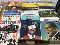 All 20 LPs arranged on table showing front sleeves