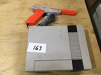 Top view of NES console with Zapper on top