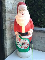 Front view of lit Santa blow mold showing full figure, color details, size perspective