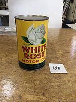 Front view of yellow White Rose motor oil can with graphics
